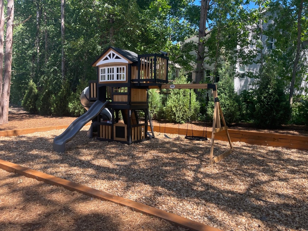 Completed 2-story playset with nest swing — Hastings handyman services